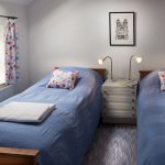 Twin bedroom with Kath Kidston curtains Twin bedroom